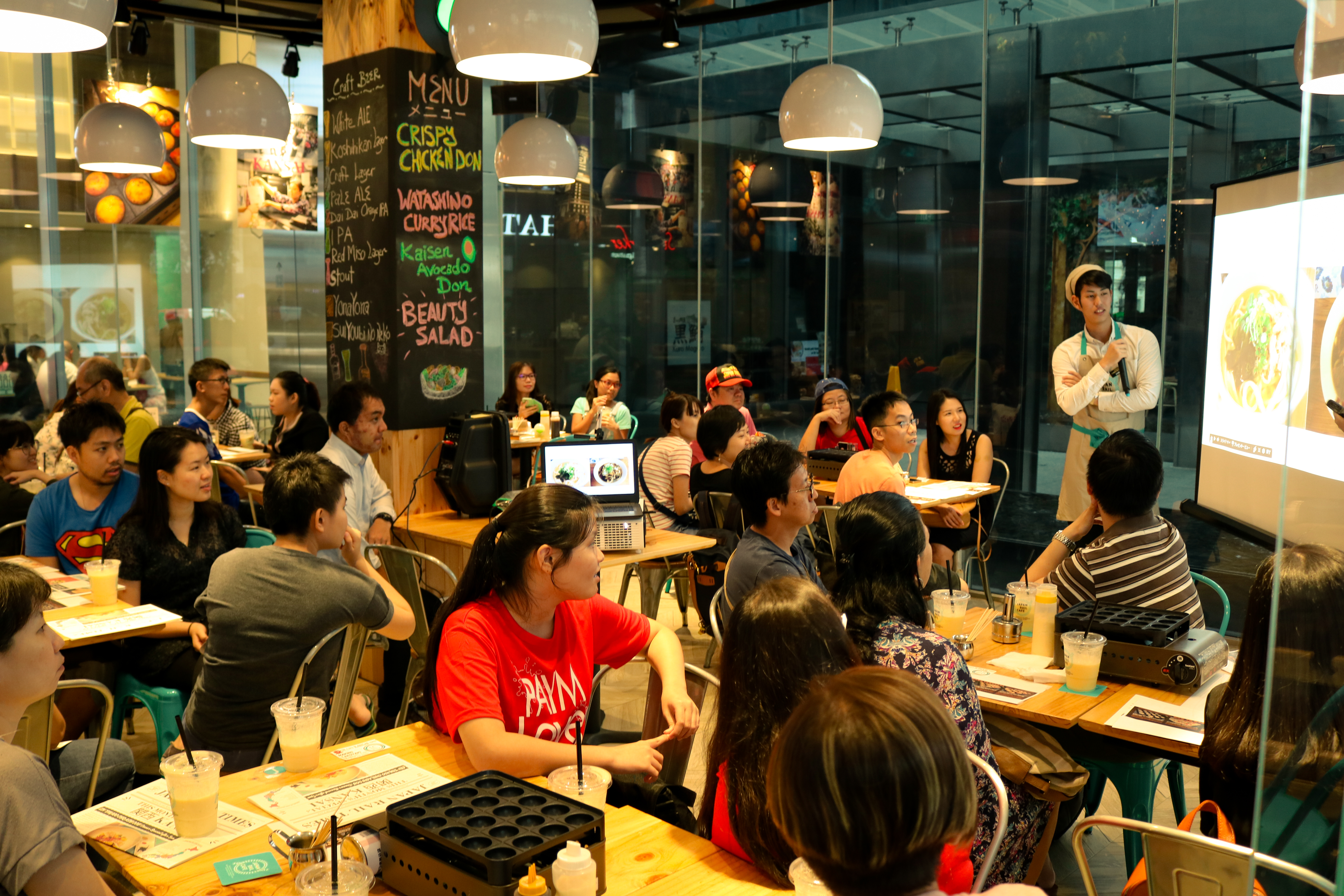 Our Japan Lovers listening attentively in the introductory seminar on Osaka's street food culture.